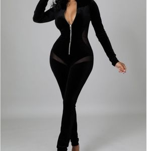 Black velvet cut out one piece jumper.